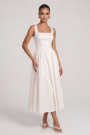 Dèlency Solène ivory midi dress with full gathered skirt, model view